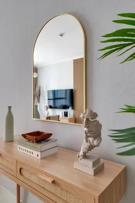 a dressing table with a mirror and a statue on it at Dubai Marina Promenade 1BR Apartment with Pool near JBR in Dubai
