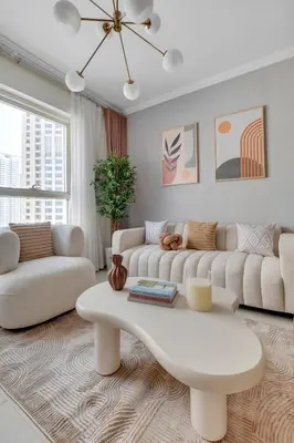 a living room with two couches and a coffee table at Dubai Marina Promenade 1BR Apartment with Pool near JBR in Dubai