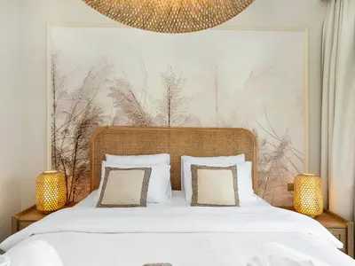 a bedroom with a large bed with white sheets and pillows at Luxury Spacious 2 Bedroom Private Beach and Views in Dubai