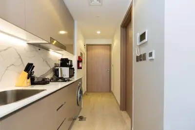 a kitchen with a sink and a counter top at CitiHome - Studio Azizi Riviera in Dubai