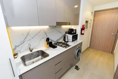 a kitchen with a sink and a counter top at CitiHome - Studio Azizi Riviera in Dubai