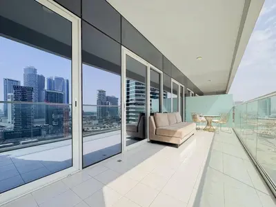 a living room with a view of the city at Bronzite 2-Bed Apt Central Dubai Canal Views in Dubai