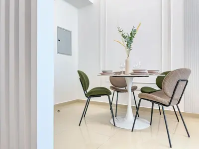 a dining room with a table and chairs at Upgrade Unit for 6 pax with Sea View Ideal Location Near Beach Big Balcony in Dubai