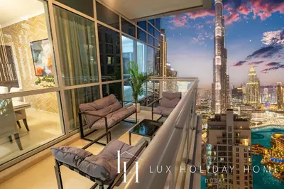 a balcony with a view of the city at LUX The Burj Khalifa Fountain View Suite 3 in Dubai