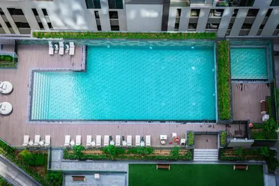 an overhead view of a swimming pool in a building at Luxury 1BR Suite - Comfort Meets Class in Dubai