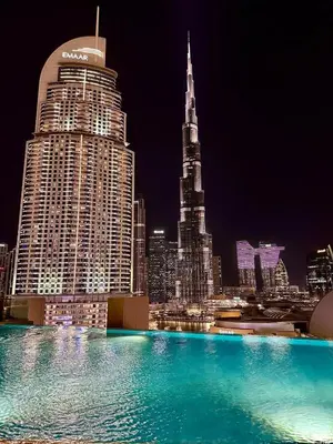 a view of a city skyline at night at Elegant apartment Dubai downtown in Dubai