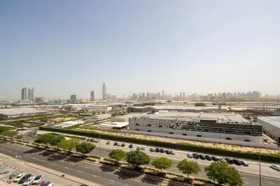an aerial view of a city with a parking lot at Frank Porter - Noor 3 Midtown in Dubai