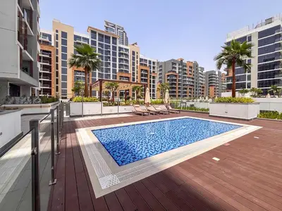 a swimming pool on top of a building with buildings at Frank Porter - Azizi Riviera 36 in Dubai