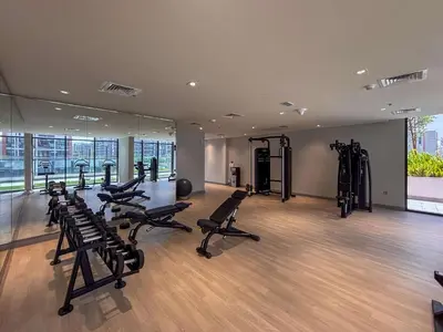 a gym with treadmills and exercise equipment in a building at Frank Porter - Azizi Riviera 36 in Dubai