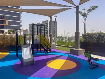 a playground with a slide on a roof at Frank Porter - Azizi Riviera 36 in Dubai