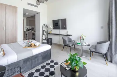 a hotel room with a bed and a kitchen at Frank Porter - Azizi Riviera 36 in Dubai