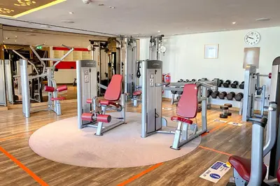 a gym with treadmills and exercise machines at ALiving Luxury 3BR High-Rise I Burj Khalifa View I Paramount Towers, 6101 in Dubai
