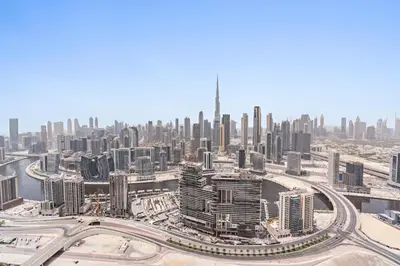 an aerial view of a city with tall buildings at ALiving Luxury 3BR High-Rise I Burj Khalifa View I Paramount Towers, 6101 in Dubai