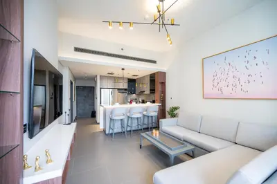 a living room with a couch and a bar at High Floor With Marina View in Dubai