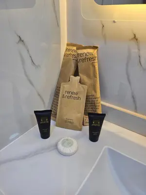 a counter top with three cups and a friday streetrett at Royal Residence - Dream tower Marina in Dubai