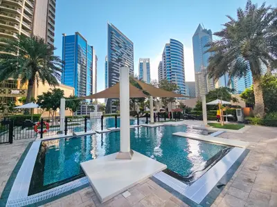 a swimming pool in a city with tall buildings at EasyGo-Signature, City Center, City view in Dubai