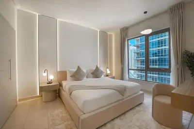 a bedroom with a bed and a large window at EasyGo-Signature, City Center, City view in Dubai