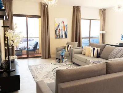 a living room with a couch and a table at 2Br Panoramic sea view, Ain Dubai, Palm, JBR beach in Dubai