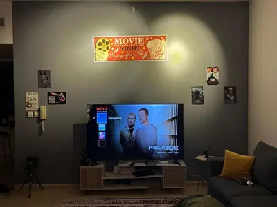 a flat screen tv in a living room at 50 Shades of stay in Dubai