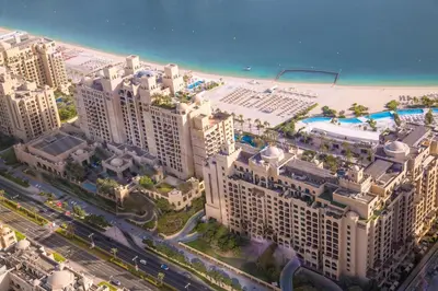an aerial view of a resort with a beach at Palm Jumeirah Beach Paradise at Fairmont Residence in Dubai