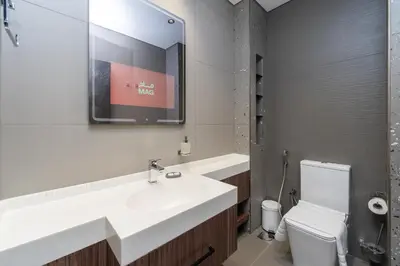 a bathroom with a sink and a toilet at Brand New Luxury One Bedroom in Dubai