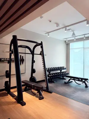 a gym with several tread machines in a room at Brand new and stylish 2BR with stunning views - Creek Palace in Dubai