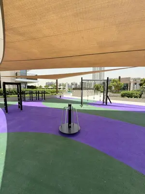a room with purple and green carpet and tables at Brand new and stylish 2BR with stunning views - Creek Palace in Dubai