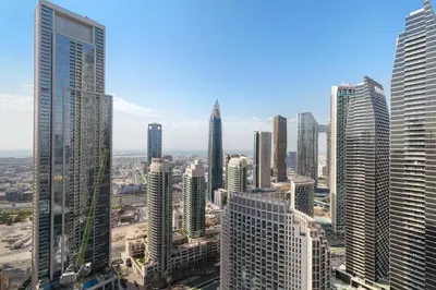 an aerial view of a city with tall buildings at Burj Khalifa View 2 BR Apartment w Parking in Dubai