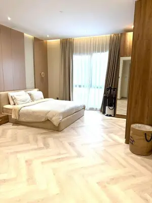 a large bedroom with a bed and a large window at Cozy, Fully Fitted Smart Home in Dubai
