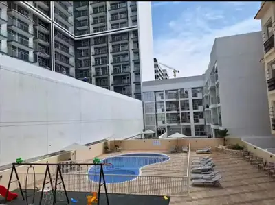 a building with a swimming pool in a city at ARS vacation homes rental in Dubai