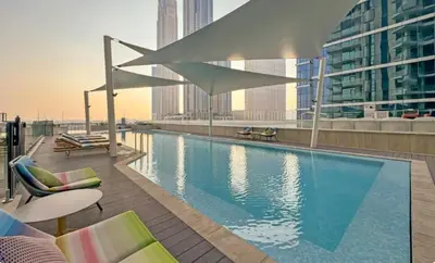 a swimming pool on top of a building at 26- Apartment in Business Bay Dubai with Balcony & Pool in Dubai