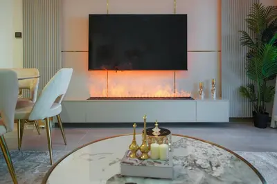a living room with a fireplace and a tv at 26- Apartment in Business Bay Dubai with Balcony & Pool in Dubai
