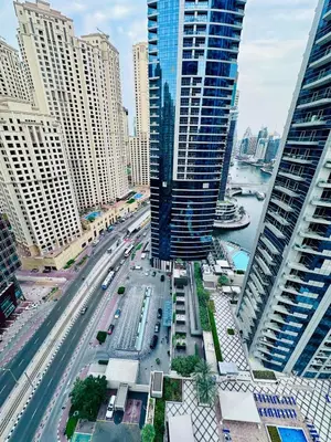 an aerial view of a city with tall buildings at Stylish place with Breathtaking Marina Views in Dubai