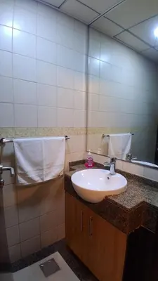 a bathroom with a sink and a mirror at Stylish place with Breathtaking Marina Views in Dubai