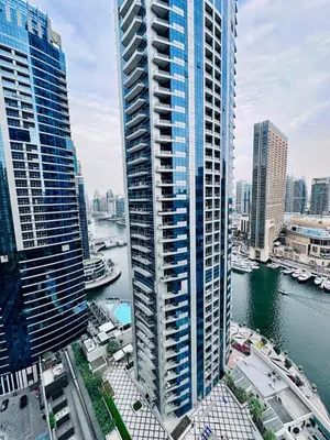 a view of a city with tall buildings and a river at Stylish place with Breathtaking Marina Views in Dubai