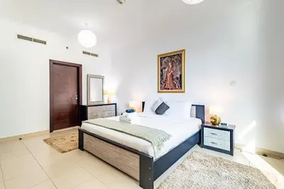 a bedroom with a large bed in a room at Vibrant 2BR in Burj Views - Near Dubai Mall & Burj in Dubai
