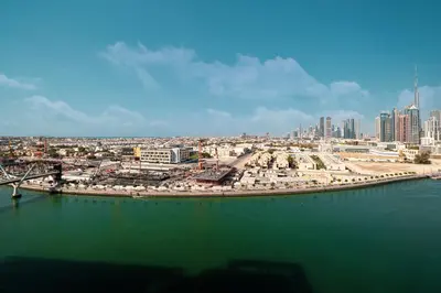 a view of a city from the water at Luxury Canal Front with Burj Khalifa Skyline View in Dubai
