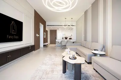 a living room with a couch and a table at Luxury Canal Front with Burj Khalifa Skyline View in Dubai