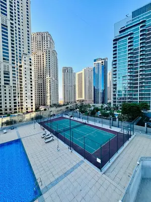 a tennis court in the middle of a city at Vibrant Marina Retreat! in Dubai