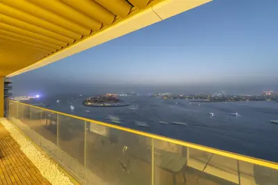a view of the runway from the balcony of a building at Grand Bleu I Private Beach I Palm Jumeirah, Sea & Sky Views I Infinity Pool I PS5 I by Skyline Serenity in Dubai