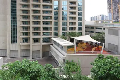 a building with a tent in front of a building at Stylish 1BR plus study room with Queen bed in Dubai