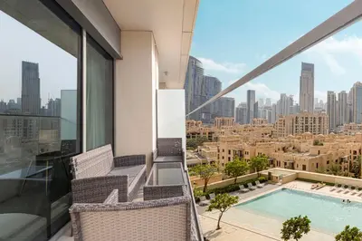 a balcony with a view of a city at Lux apartment with full Burj View - 5 min walk to Dubai Mall in Dubai
