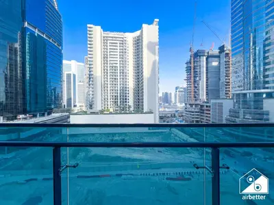 a view of the city from a swimming pool in a skyscraper at Luxury 2BR in Merano Tower & Stunning Canal Views in Dubai