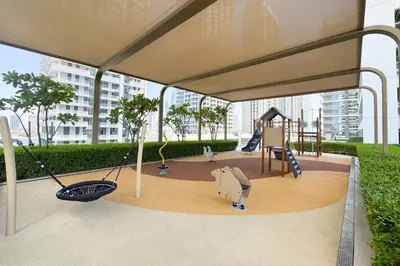 a canopy with a playground with a swing at Iconic 3 Bedroom with Panoramic View in Grand Bleu in Dubai