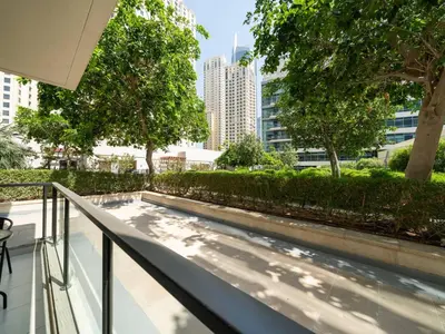 a balcony with a view of a city at Luxurious 2 Bed Waterfront Living at Marina Quays in Dubai