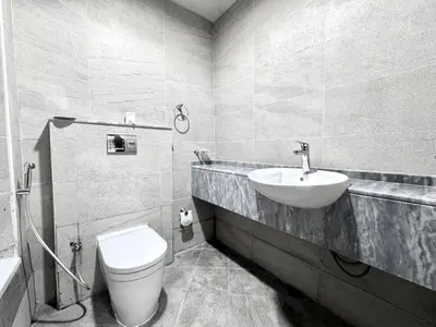 a bathroom with a toilet and a sink at Al Manara Classic Deluxe Sheikh Zayed Studio in Dubai