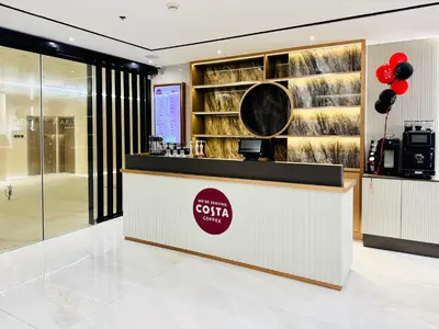 a lobby of a coffee shop with red balloons at Al Manara Classic Deluxe Sheikh Zayed Studio in Dubai