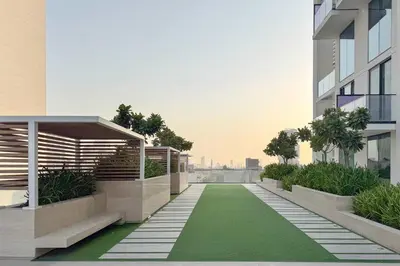 a balcony of a building with a green lawn at PVH - Elegant 1BR in Binghatti House in Dubai