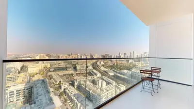 a glass balcony with a view of a city at PVH - Stylish 1BR in Binghatti House in Dubai