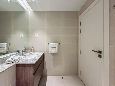 a bathroom with a sink and a mirror at HiGuests - Modern Escape in Jumeirah Bliss in Dubai